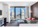 Bright living room with city views, a comfortable sofa, and modern furnishings at 4381 W Flamingo Rd # 2504, Las Vegas, NV 89103