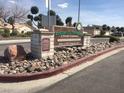 Ridgemount Townhomes sign in a community with lush landscaping and well-maintained grounds at 5716 Ridgeline Ave, Las Vegas, NV 89107