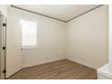 A well-lit bedroom offers a serene space with a large window at 8446 Vacarez Dr, Las Vegas, NV 89149