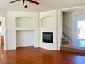 Bright living room with ceiling fan, tile entryway and a cozy fireplace feature at 9299 Adamshurst Ave, Las Vegas, NV 89148