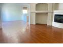 Bright living room with hardwood floors, fireplace, and an open layout perfect for entertaining at 9299 Adamshurst Ave, Las Vegas, NV 89148