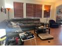 Living room with wood floors, recessed lighting, and large window with blinds at 9299 Adamshurst Ave, Las Vegas, NV 89148
