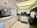 Spacious kitchen showcasing modern appliances, granite countertops, and ample storage at 1105 Sulphur Springs Ln # 202, Las Vegas, NV 89128