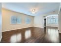 Bright living room boasts hardwood floors, natural light from windows, and a ceiling fan at 2100 Quarry Ridge St # 106, Las Vegas, NV 89117