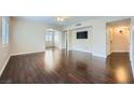 Spacious living room features hardwood floors, neutral paint, and modern ceiling fan at 2100 Quarry Ridge St # 106, Las Vegas, NV 89117