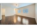 Inviting living room with hardwood floors, natural light, and a neutral color scheme at 2100 Quarry Ridge St # 106, Las Vegas, NV 89117