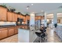 Kitchen features stainless steel appliances, granite countertops, and breakfast bar with seating at 2345 Gondi Castle Ave, Henderson, NV 89044