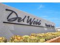 A stylish 'Del Webb North Ranch' community sign is framed by desert landscaping under a clear blue sky at 2404 Elmont Ave, North Las Vegas, NV 89086