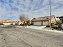 Inviting single-story home with a three-car garage and desert-friendly landscaping at 3581 Rio Paloma Ct, North Las Vegas, NV 89031