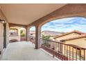 Spacious balcony with wrought iron railings and views of the neighborhood at 6856 Pipil St, Las Vegas, NV 89166