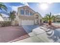 Beautiful two-story home featuring a well-manicured yard and attached two-car garage at 7973 Macklin St, Las Vegas, NV 89129