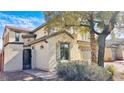 Beautiful stucco home featuring desert landscaping and a decorative wrought iron gate at 8216 Chimney Bluffs St, North Las Vegas, NV 89085