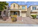 Two story home with stucco and stone exterior, desert landscaping, and an attached one car garage at 9748 Villa Lorena Ave, Las Vegas, NV 89147
