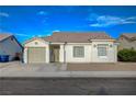 Charming single-story home featuring a well-maintained front yard with a one car garage and inviting entry way at , Las Vegas, NV 89106