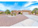 Charming home with low-maintenance landscaping, a tile roof, and attached two-car garage at 10917 Mcneese Ct, Las Vegas, NV 89134