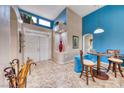 Bright foyer with high ceilings, stylish tile flooring, and elegant decor at 10917 Mcneese Ct, Las Vegas, NV 89134