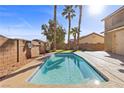 Inviting backyard pool with lush landscaping, perfect for outdoor relaxation and entertainment at 192 Golden Crown Ave, Henderson, NV 89002