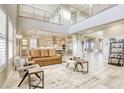 Open-concept living room with high ceilings, large windows, and a view into the modern kitchen at 2737 Josephine Dr, Henderson, NV 89044