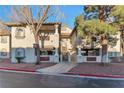 A bright condo building featuring covered parking and mature trees enhancing its curb appeal at 3408 Winterhaven St # 204, Las Vegas, NV 89108