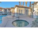 Inviting hot tub near the pool house with access steps, promising relaxation and community enjoyment at 3408 Winterhaven St # 204, Las Vegas, NV 89108