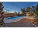 Private backyard pool with desert landscape, offering a relaxing retreat at 3731 Spencer St, Las Vegas, NV 89119