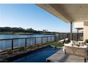 Inviting pool with lounge seating and a stunning view of the lake at 42 Lakefront Dr, Henderson, NV 89011
