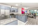 Modern kitchen with stainless steel appliances, granite countertops, open floor plan, and stylish accents at 4575 Dean Martin Dr # 1103, Las Vegas, NV 89103