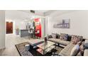 Open-concept living room with modern decor, a view of the kitchen, and a comfortable seating area at 4575 Dean Martin Dr # 1103, Las Vegas, NV 89103