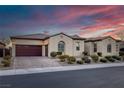 Charming single-story home featuring well-manicured landscaping, a tile roof, and a two car garage at 6333 Orto Vaso Ave, Las Vegas, NV 89131