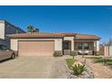 Charming single-story home featuring a tile roof, desert landscaping, and inviting front porch at 720 Camino La Paz, Henderson, NV 89012