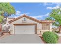 Charming single-story home featuring a well-maintained front yard and a spacious two-car garage at 7608 Sierra Paseo Ln, Las Vegas, NV 89128