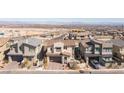 An aerial view showcases this property in its neighborhood, with mountain views in the distance at 828 Parker Mesa St, Las Vegas, NV 89138