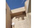 Exterior shot showing the home's balcony with curving stucco work at 2200 Highpointe Dr # 201, Laughlin, NV 89029