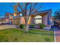 Charming two-story home with desert landscaping, three-car garage, and a tiled roof at 2813 Via Avanti St, Henderson, NV 89074