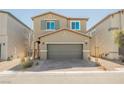 Two-story home boasts a neutral exterior, arched entryway and an attached two-car garage at 3747 Lambent Ave, North Las Vegas, NV 89084