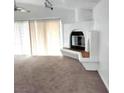 Bright living room featuring a fireplace, vaulted ceilings, and lots of natural light at 4508 W San Miguel Ave, North Las Vegas, NV 89032
