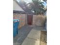 Backyard with a concrete block wall and access door at 4795 Via San Andros, Las Vegas, NV 89103