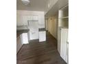Efficient kitchen space with white cabinets, granite countertops and modern appliances at 5128 Forrest Hills Ln, Las Vegas, NV 89108