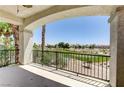 A covered balcony overlooks the golf course and distant neighborhood at 52 Cascade Lake St, Las Vegas, NV 89148