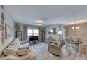 Bright living room with a comfortable sofa, natural light, and stylish decor at 555 E Silverado Ranch Blvd # 1025, Las Vegas, NV 89183