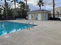 Exterior view of pool and building in the community and the beautiful clear sky at 6316 Beige Bluff St # 201, North Las Vegas, NV 89081