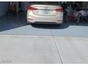 Spacious two-car garage with painted flooring at 7745 Fruit Dove St, North Las Vegas, NV 89084