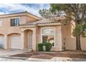 Charming two-story home with tile roof, desert landscaping, and attached one car garage at 8469 Sewards Bluff Ave, Las Vegas, NV 89129