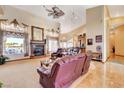 Bright living room with a fireplace, comfortable seating, and backyard views at 1440 Lost Creek Dr, Pahrump, NV 89048