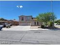 A two-story home boasting a three-car garage and a well-maintained front yard at 206 Valerian St, Henderson, NV 89015