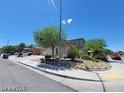 Two-story home with a three-car garage and tidy landscaping, set on a sunny day at 206 Valerian St, Henderson, NV 89015