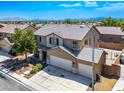 Two-story home with a two-car garage and well-maintained landscaping at 2305 Dalton Ridge Ct, North Las Vegas, NV 89031