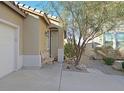Inviting front porch with desert landscaping and a comfortable bench, perfect for relaxing at 337 Mattie Brook Ave, Henderson, NV 89015