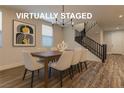 Virtually staged dining room with stylish chandelier, seating for six, and modern decor at 426 Port Reggio St, Las Vegas, NV 89138