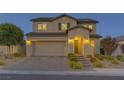 Charming two-story home showcasing a well-maintained lawn and a convenient two-car garage at 426 Port Reggio St, Las Vegas, NV 89138